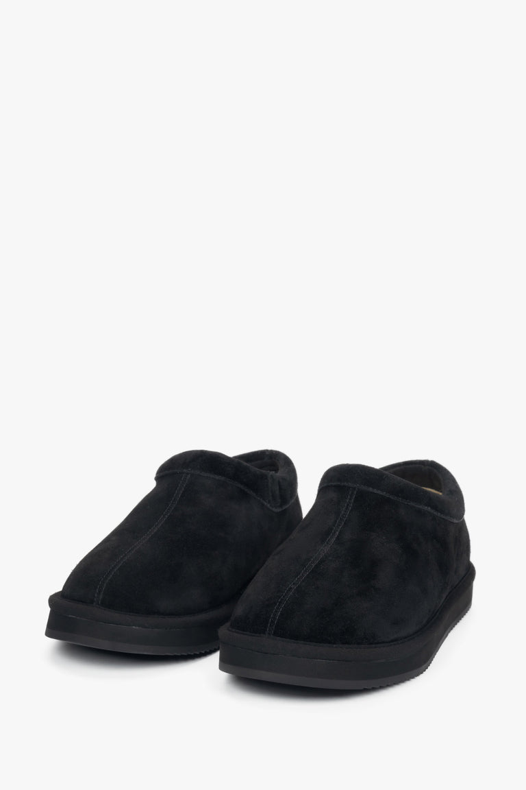 Women's black velour clogs on a flexible platform.