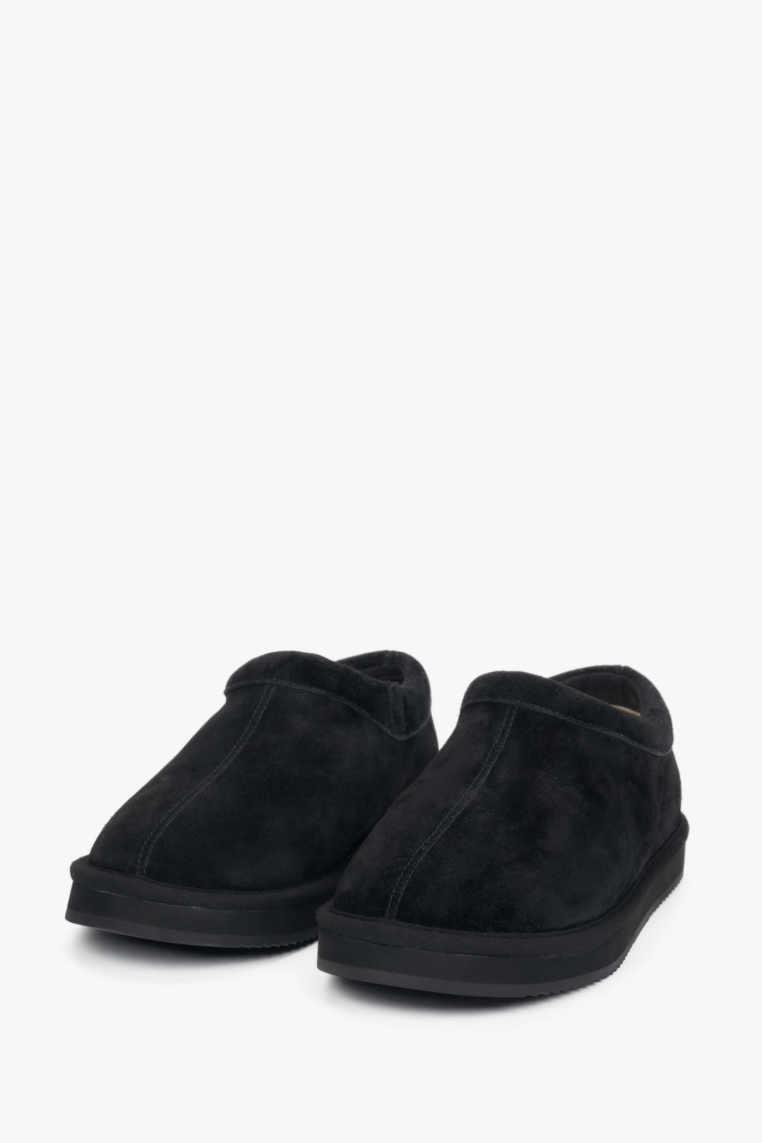 Women's black velour clogs on a flexible platform.