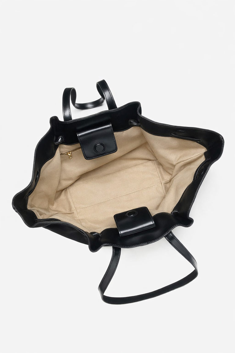 Women's black velour handbag, designed by Estro, with elegant long handles.