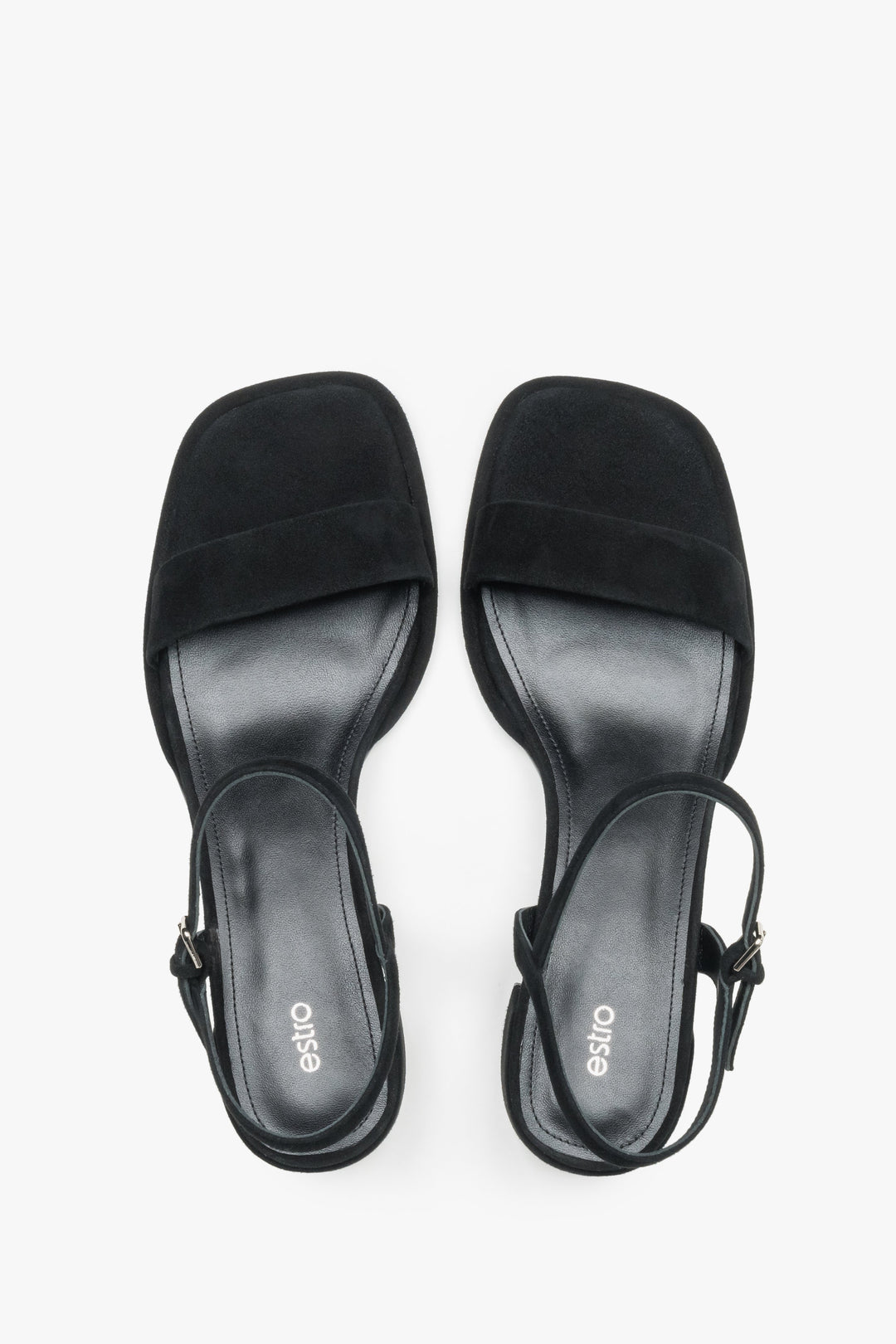 Estro black sandals featuring a low square heel and adjustable ankle strap.