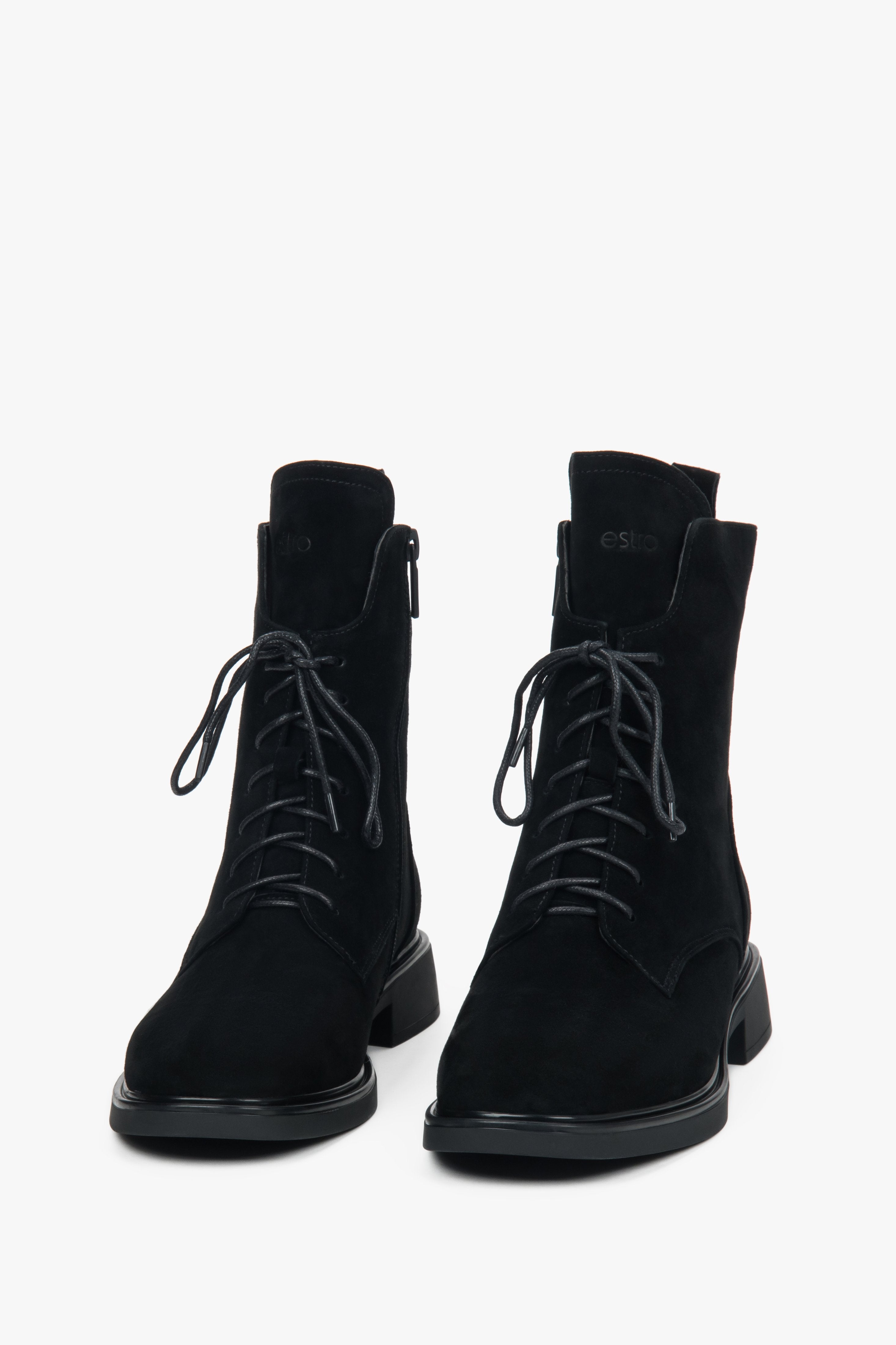 Women’s winter ankle boots made of genuine velour with decorative lacing and fur interior.