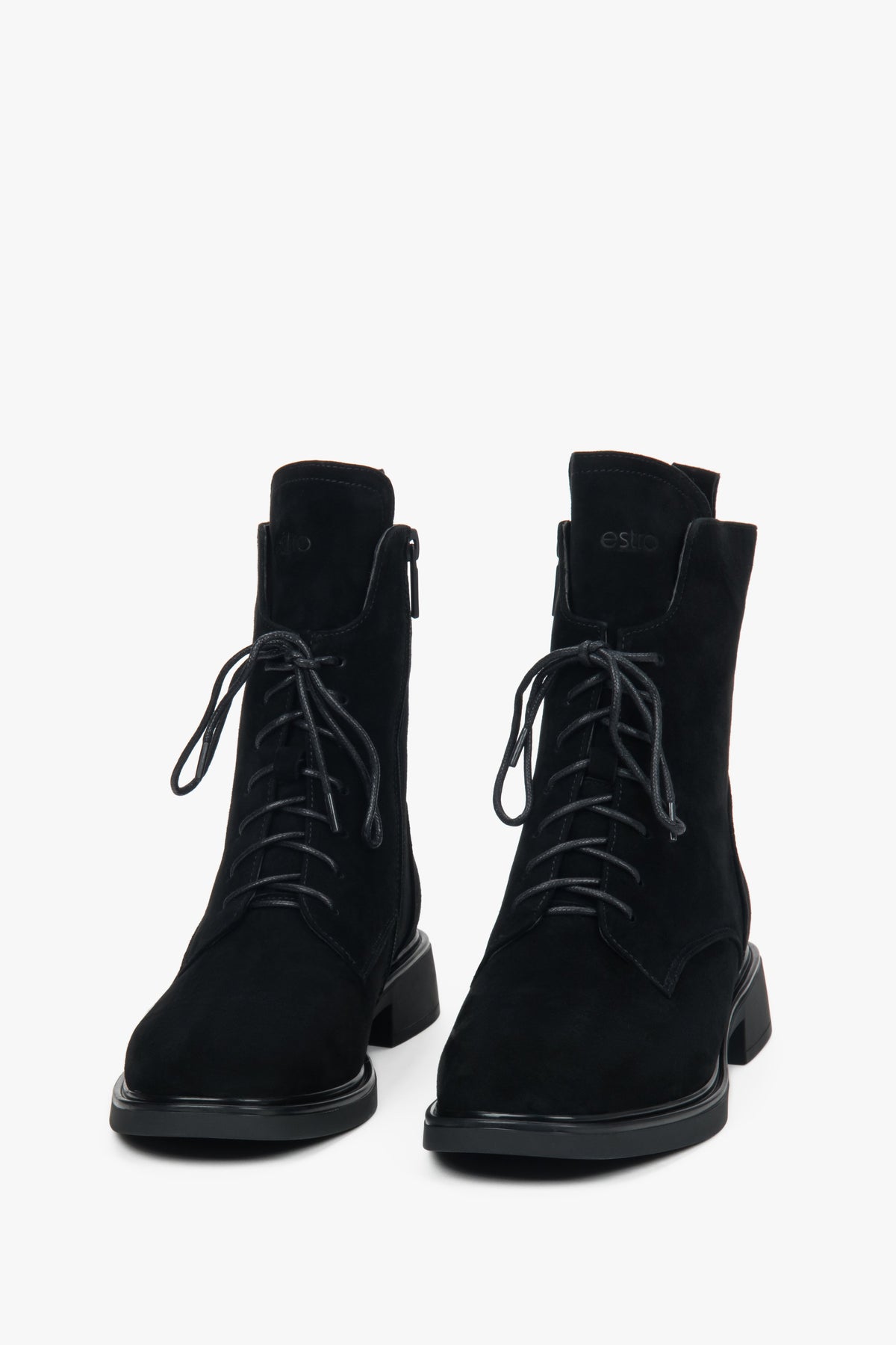 Women’s winter ankle boots made of genuine velour with decorative lacing and fur interior.