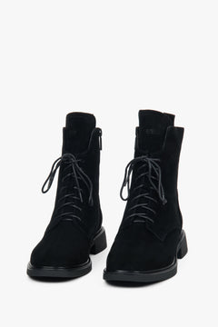 Women’s winter ankle boots made of genuine velour with decorative lacing and fur interior.