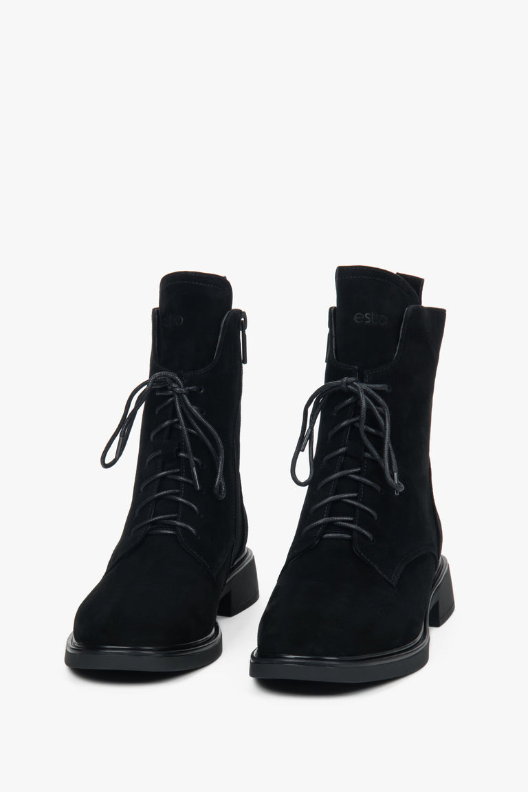 Women’s winter ankle boots made of genuine velour with decorative lacing and fur interior.