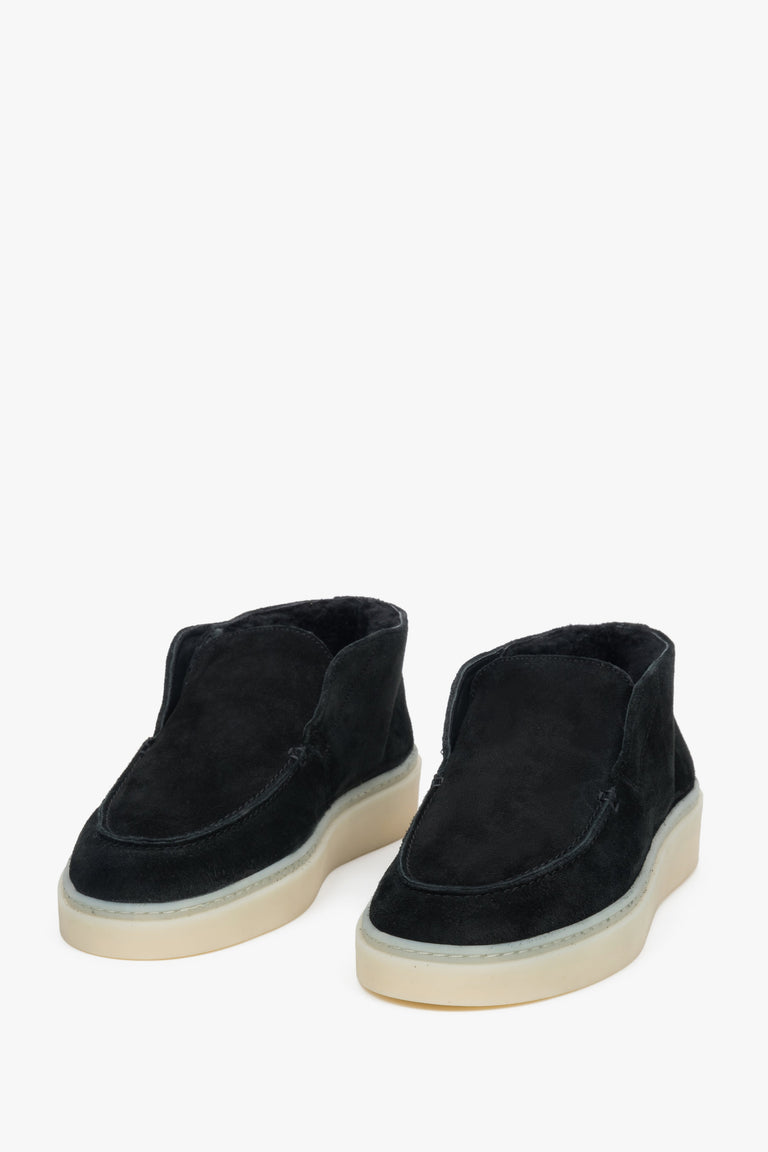 Black velour loafers with visible soft fur lining inside and on the top edge of the upper.