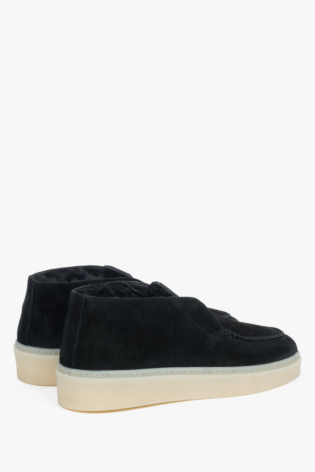 Black fur-lined women’s velour loafers.