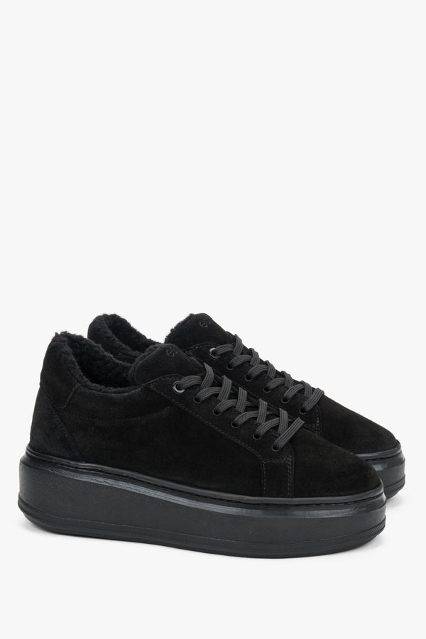 Side profile highlighting the sporty silhouette and warm fur-lined interior.