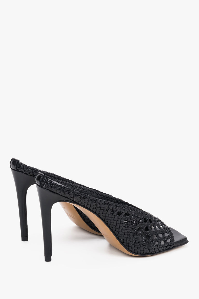 Close-up of the artisanal leather weave and modern square toe on black luxury mules.