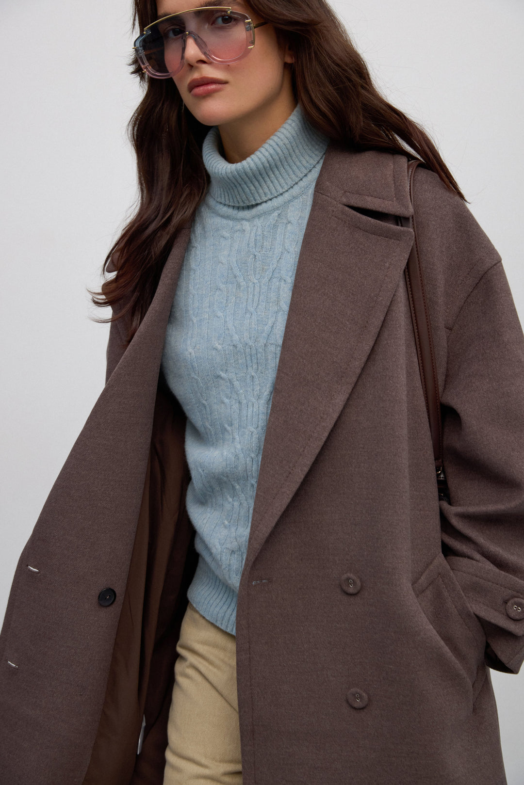 Brown Double-Breasted Women’s Coat with Waist Tie and Wide Lapels.