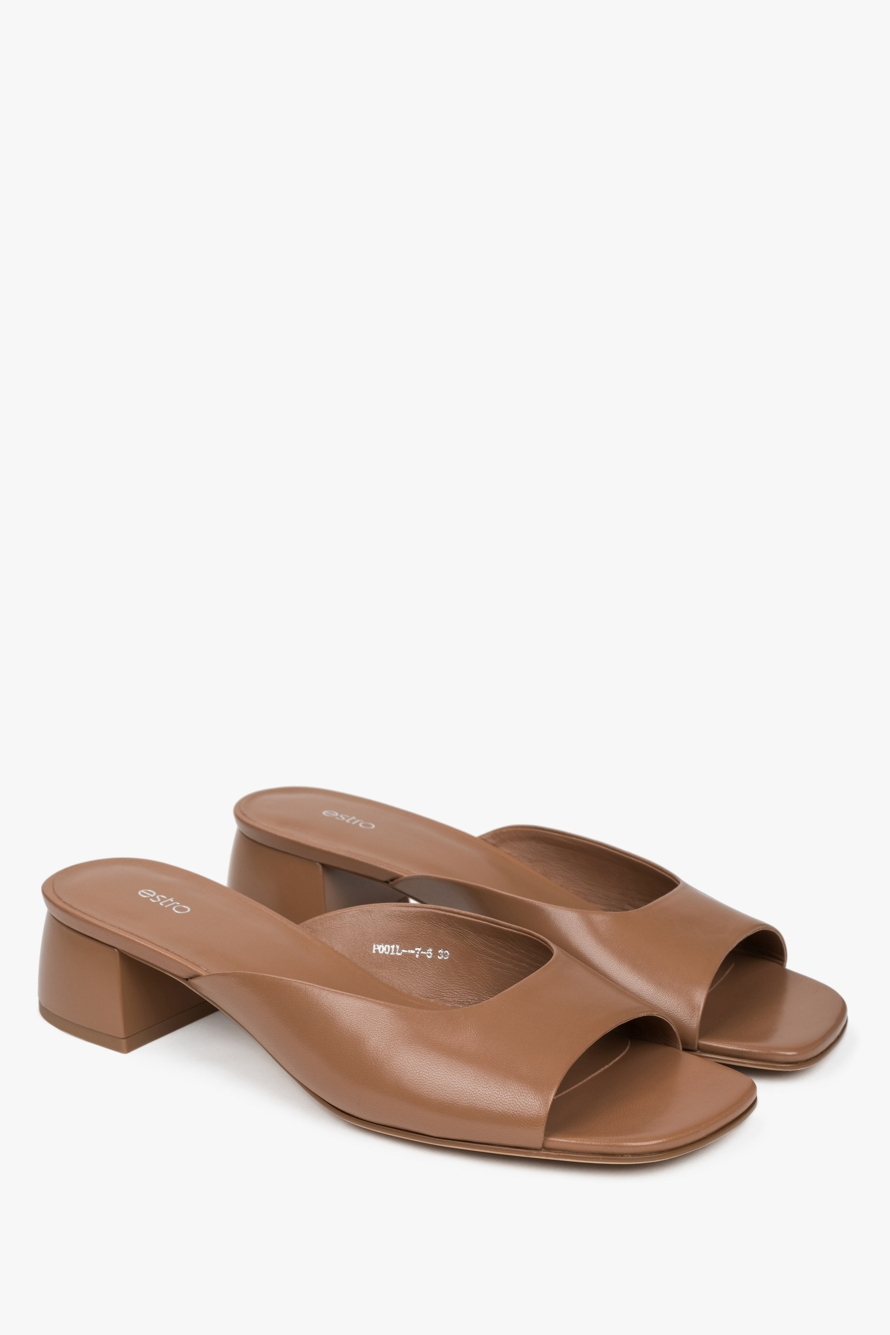 Brown women’s leather mules with low heel.
