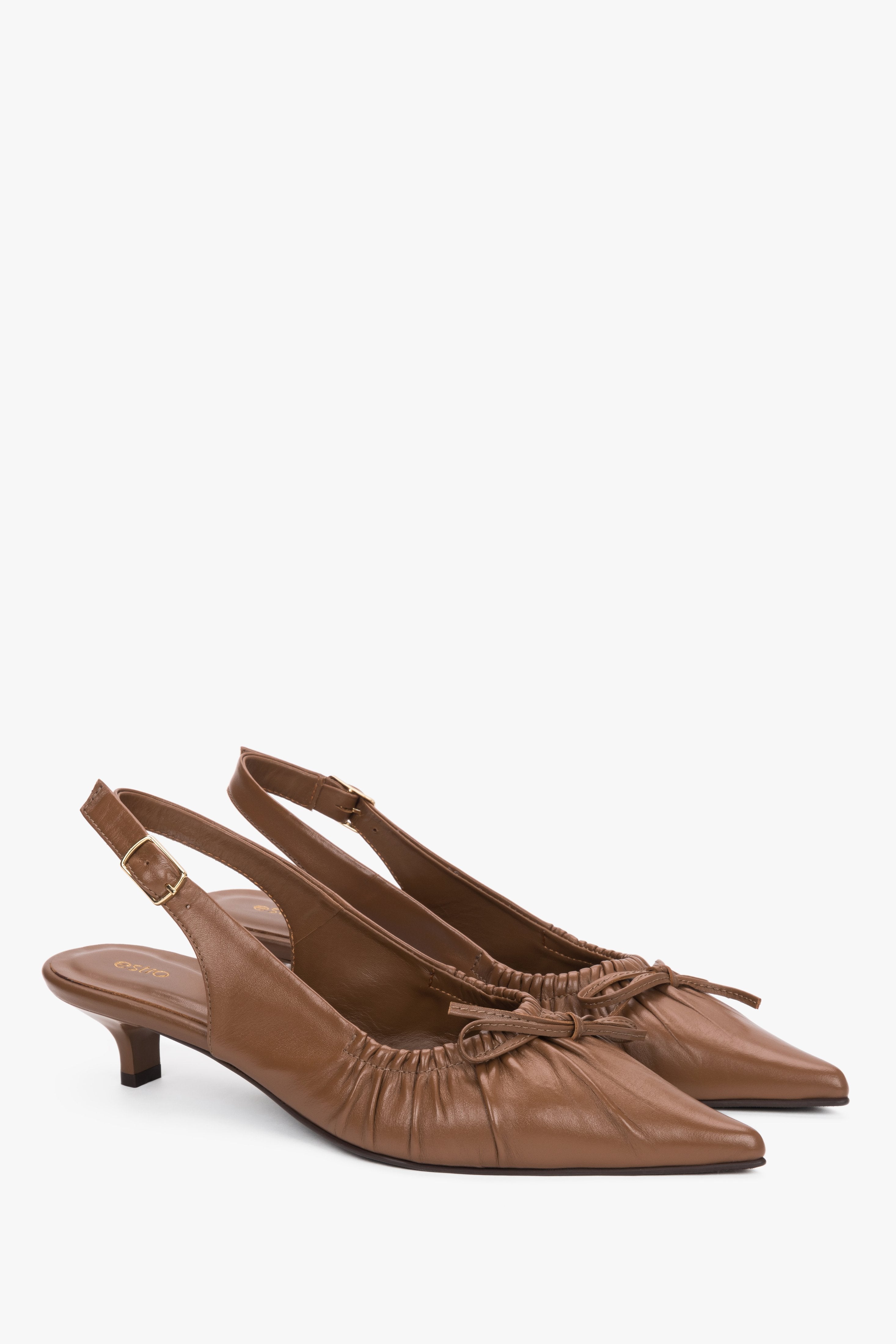 Women’s brown leather slingback pumps by Estro with a kitten heel.
