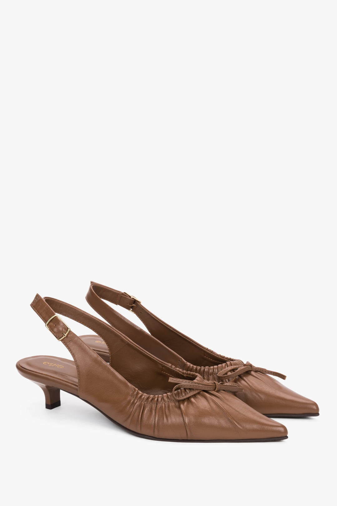 Women’s brown leather slingback pumps by Estro with a kitten heel.