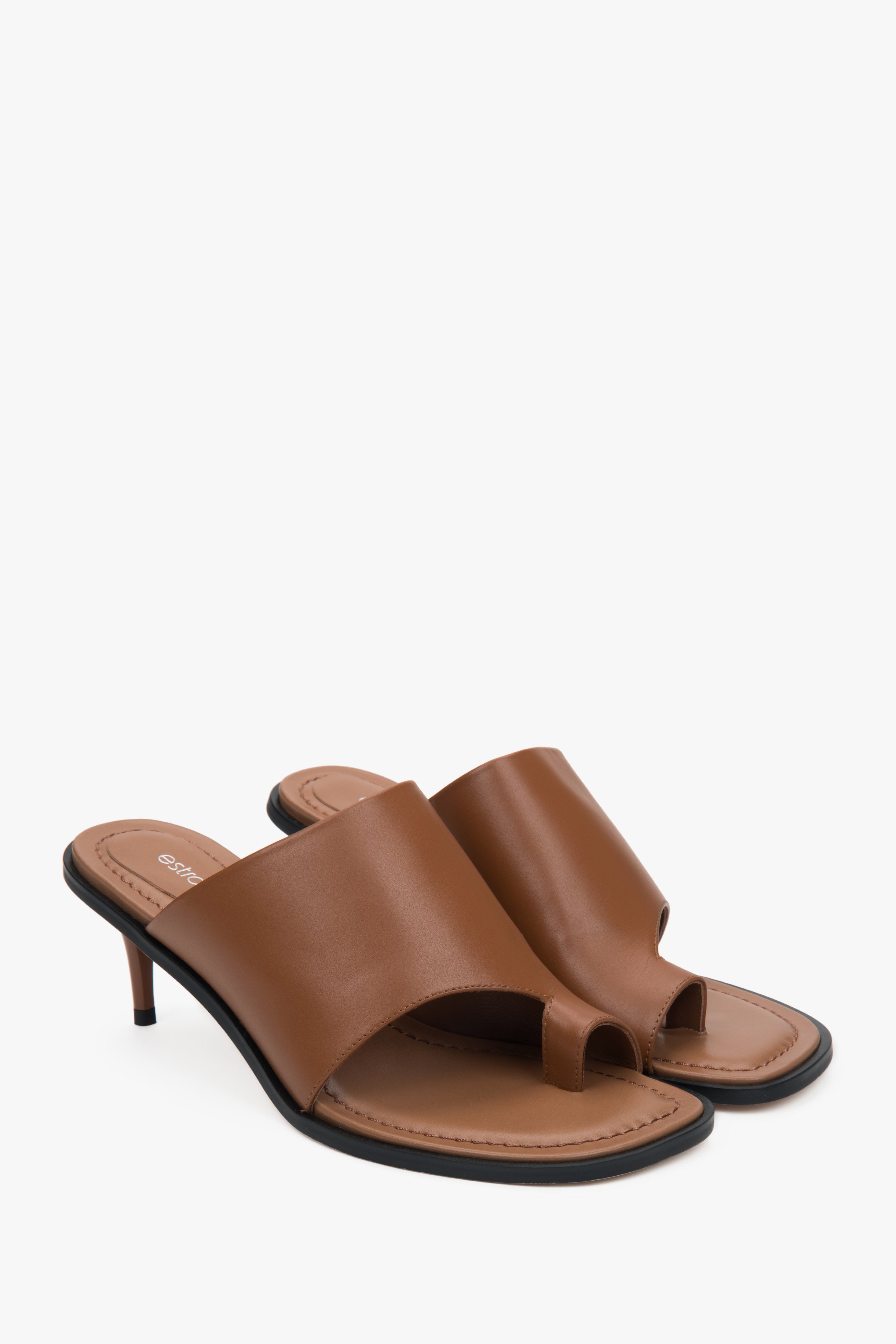 Estro brown women’s leather stiletto mules with a toe ring.