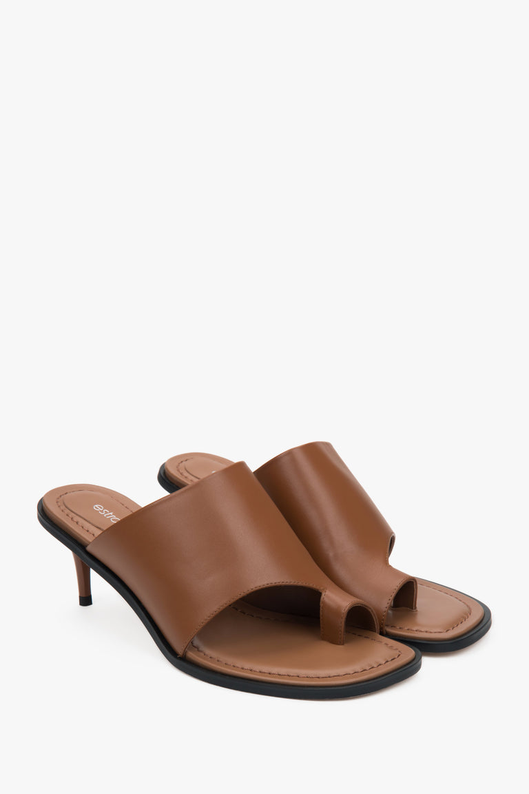 Estro brown women’s leather stiletto mules with a toe ring.