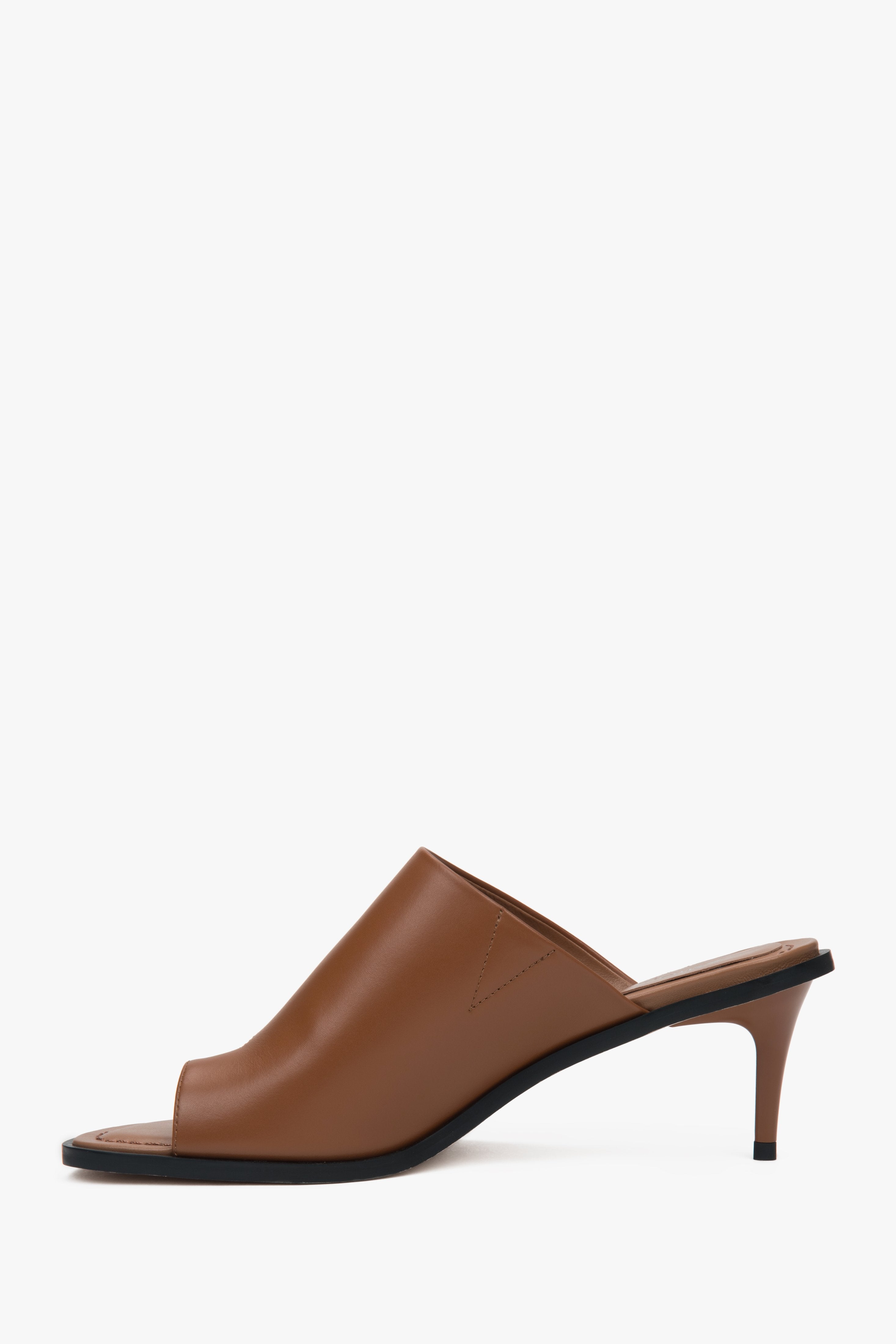 With a toe ring, brown women’s leather stiletto mules by Estro.