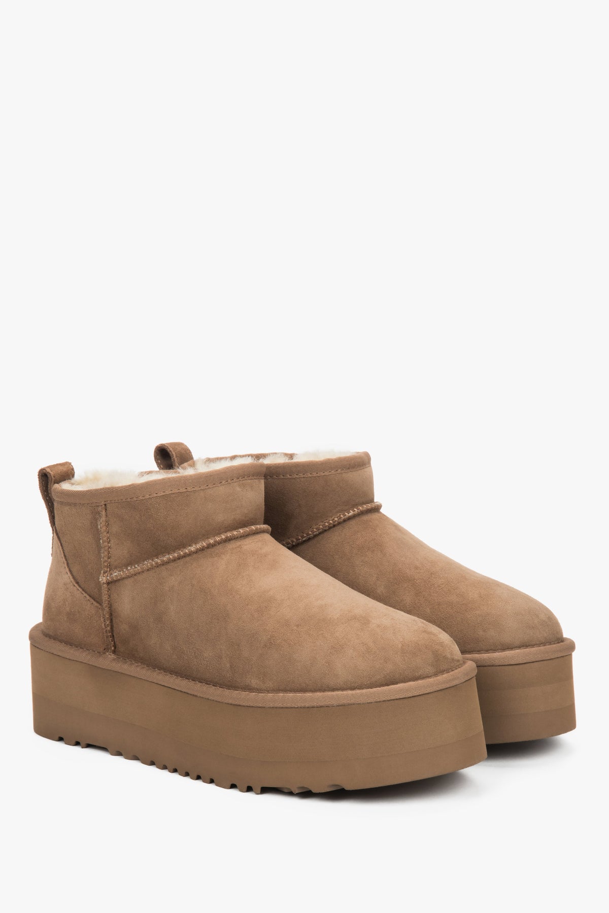 Brown women’s snow boots with a thick sole, made of genuine velour with fur lining.