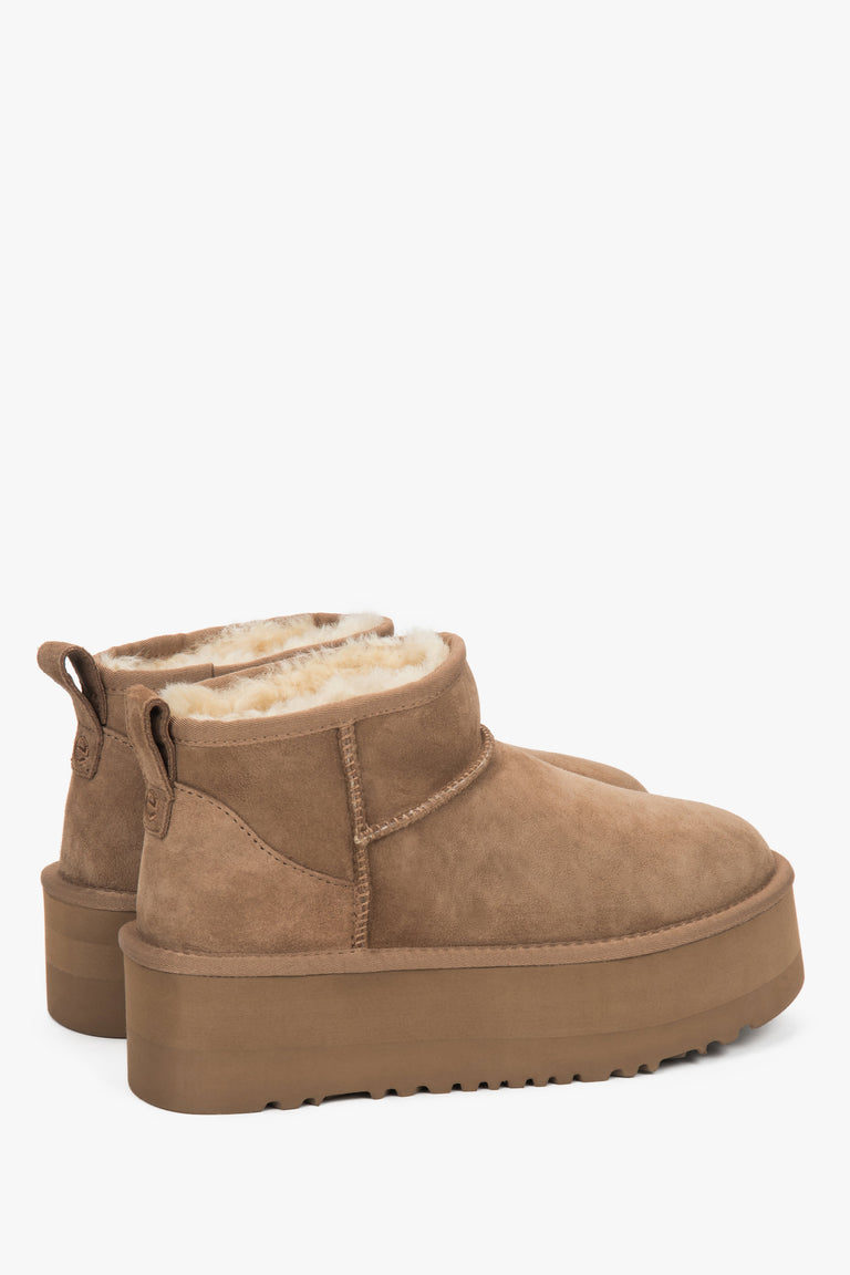 On a thick sole — brown women’s snow boots made of genuine velour with fur lining, Estro.