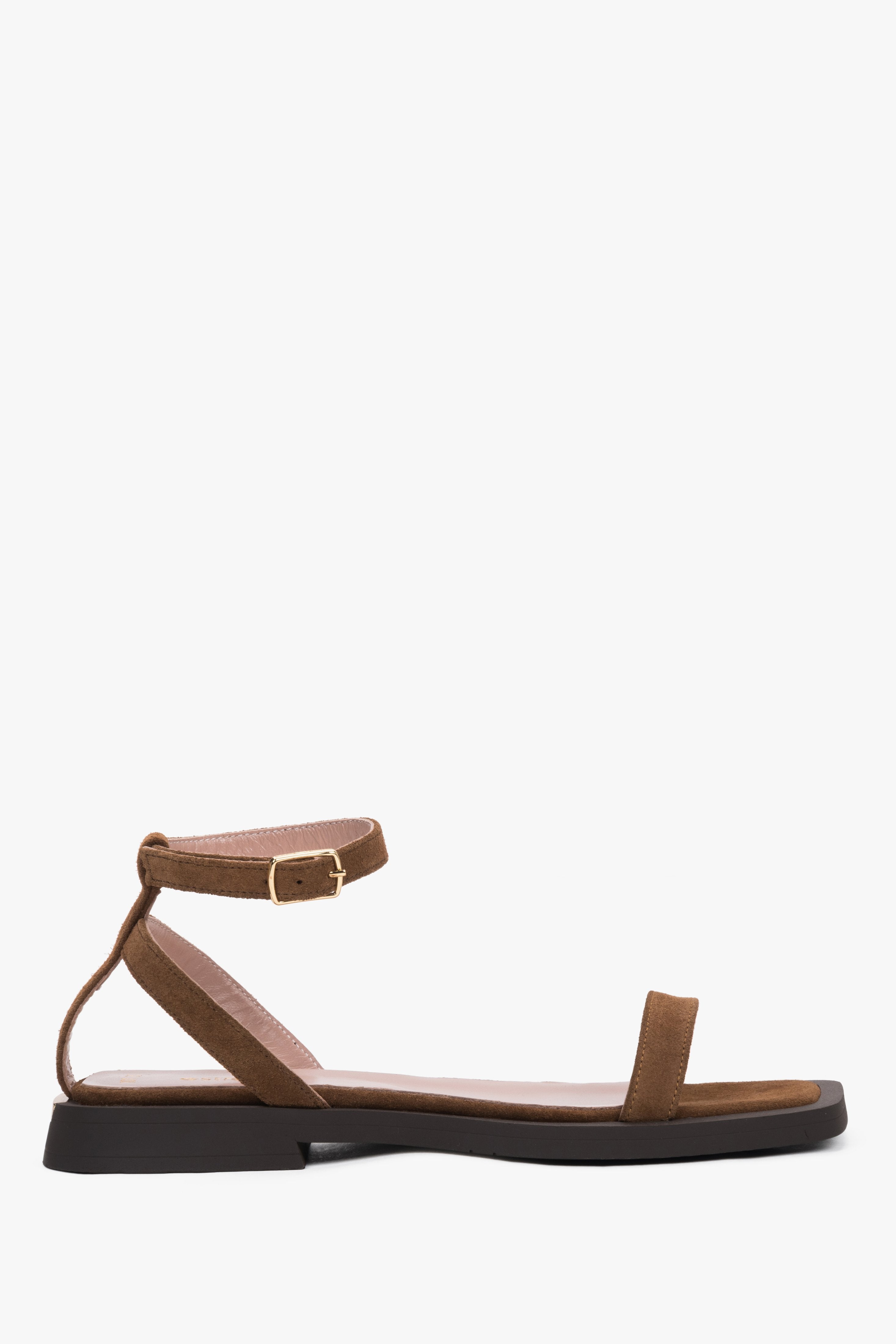 Women’s brown velour flat sandals by Estro with thin straps.