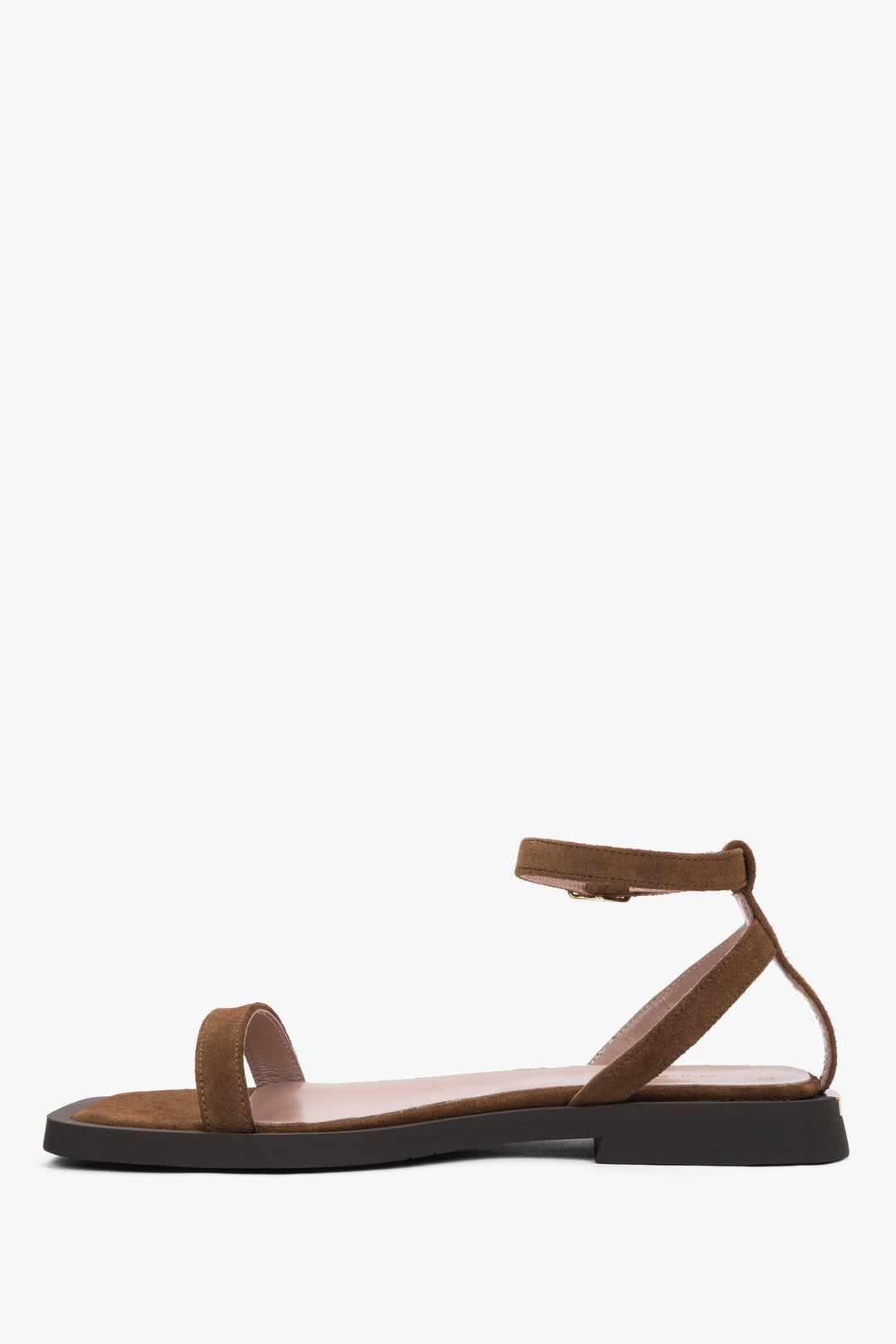 Side view of the thin straps and soft brown velour on Estro sandals.