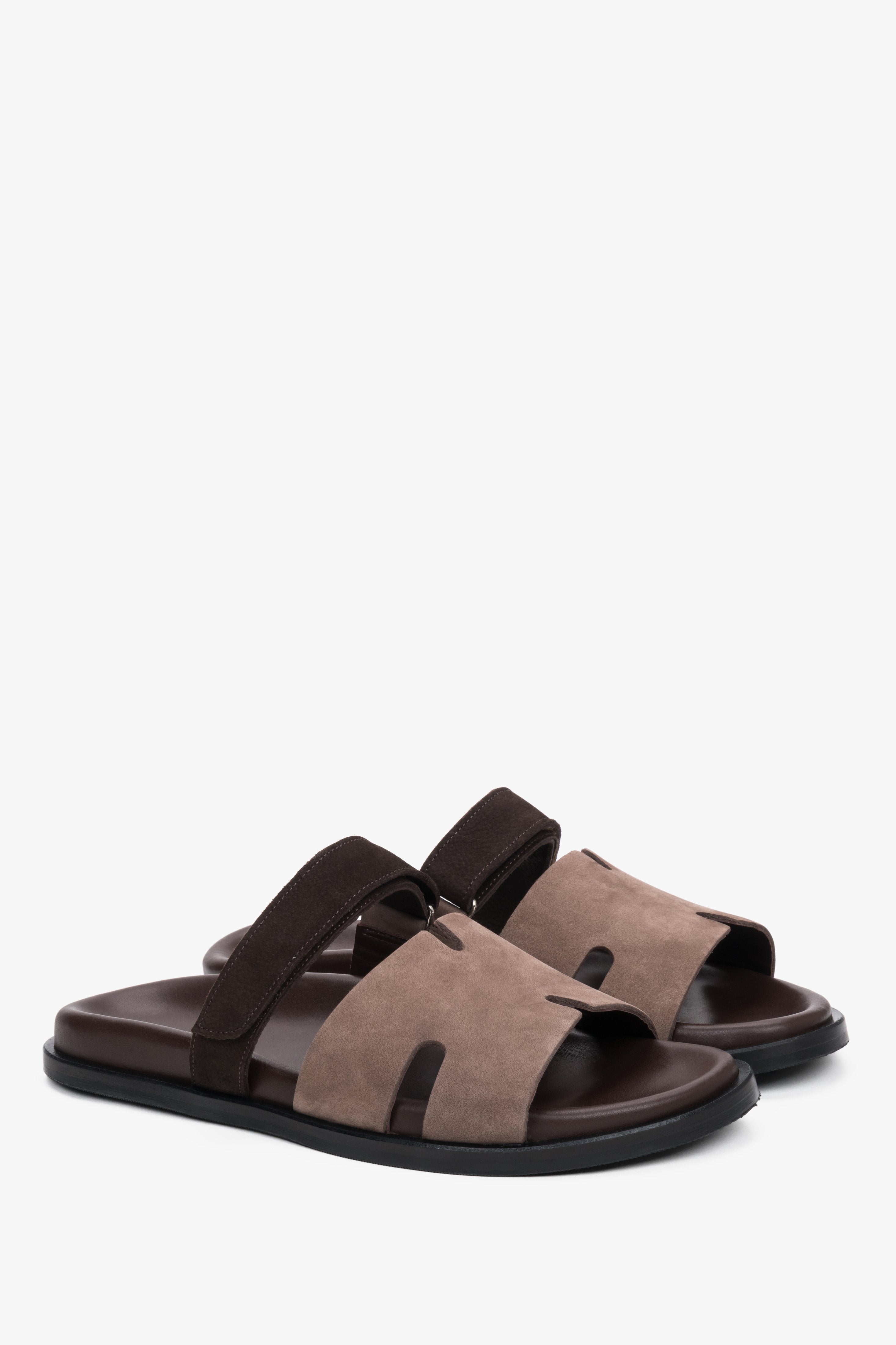 Brown leather and velour women’s slides with an adjustable strap.
