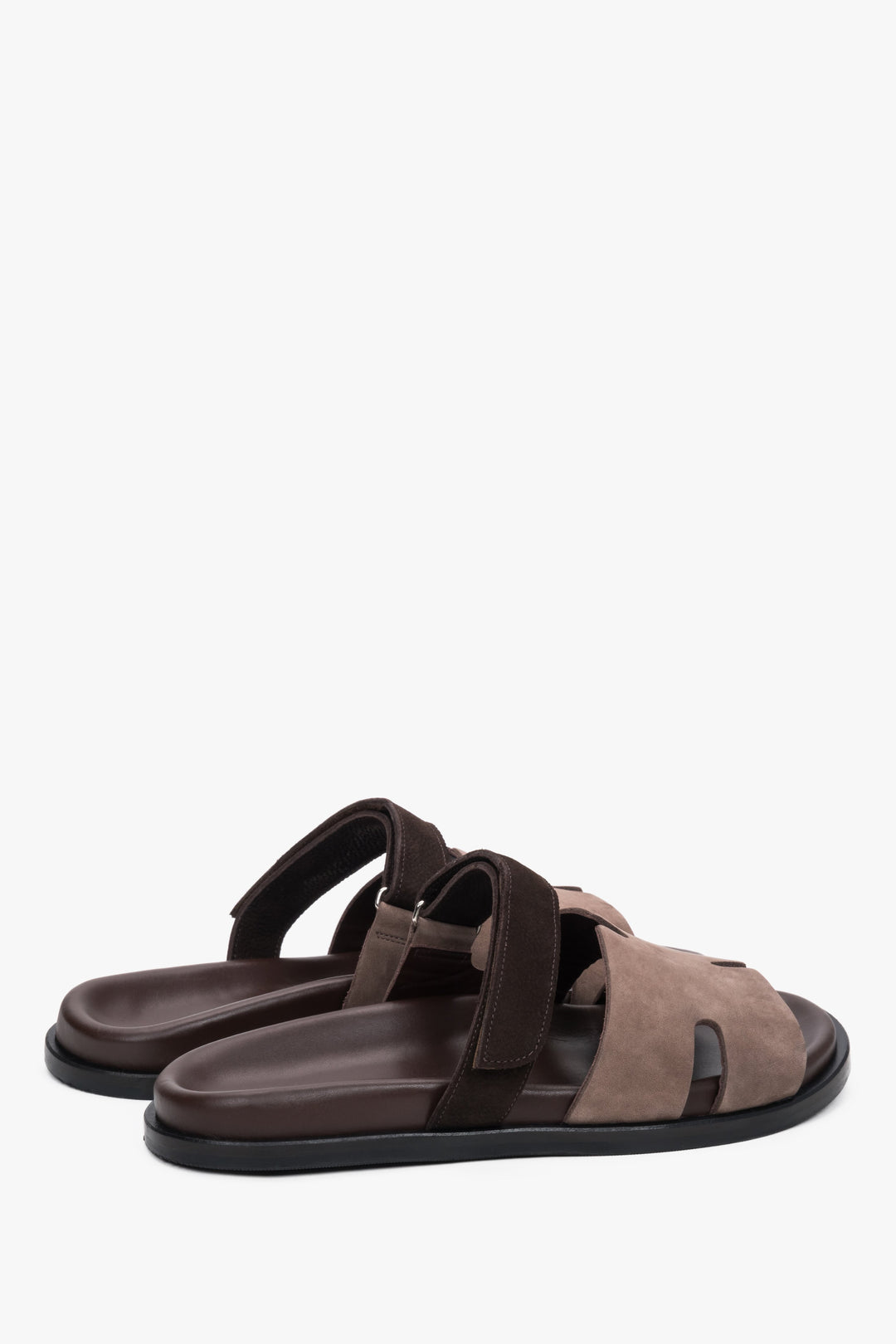 Brown leather and velour women’s slides with an adjustable strap by Estro.