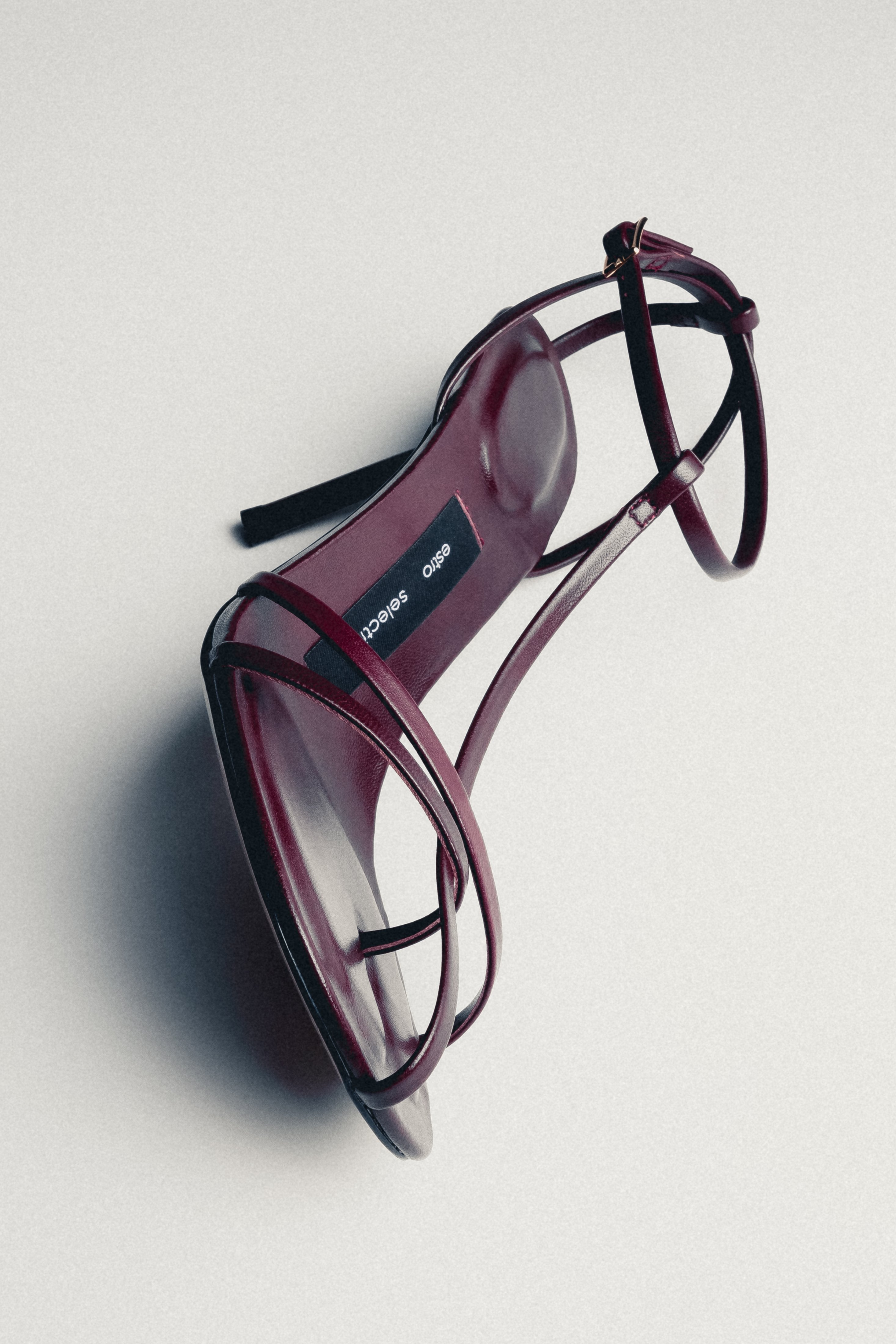 Close-up of women's burgundy leather high heel sandal with delicate straps by Estro Selection