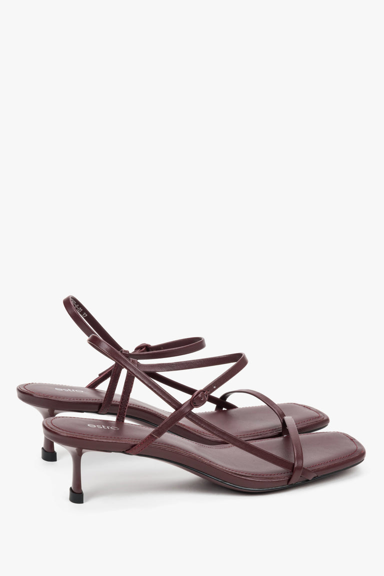 Women’s burgundy leather low-heel sandals by Estro with thin straps.