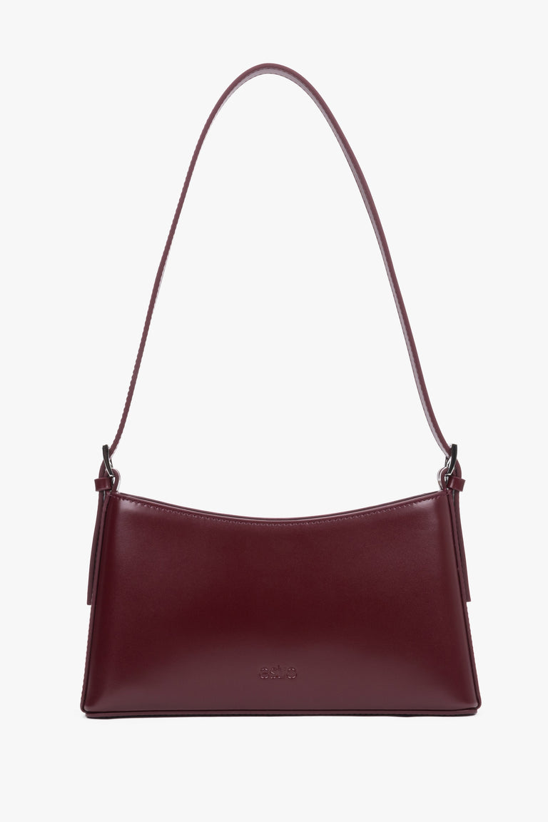 Women's burgundy leather shoulder bag by Estro with slim baguette shape.
