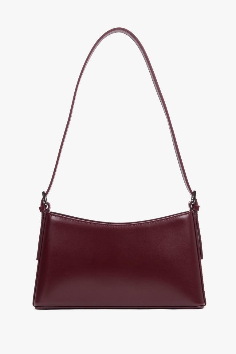Front view of burgundy leather shoulder bag with silver-toned hardware.
