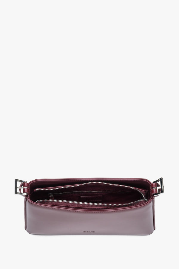 Top view of burgundy shoulder bag with zipper closure and compact shape.