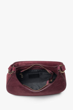 Spacious interior with textile lining, one compartment, and a practical pocket for everyday essentials.