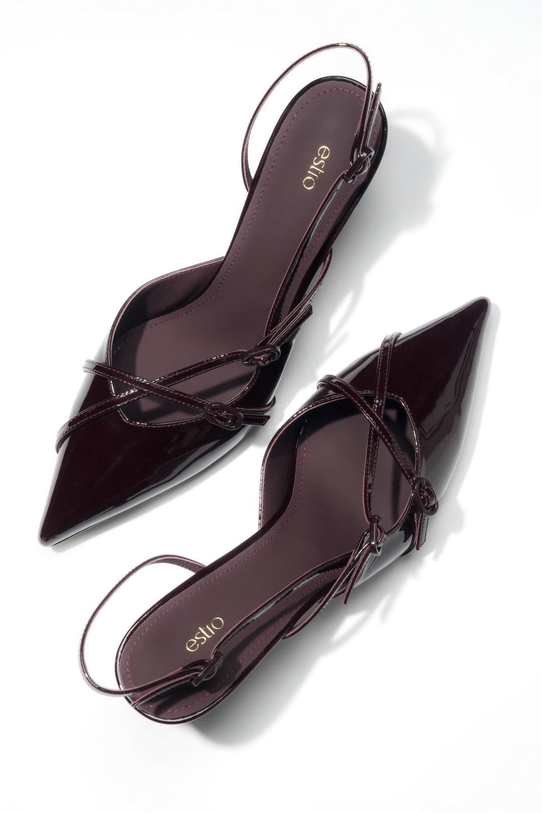 Deep, luxurious black cherry red – patent slingback pumps that redefine bold elegance.