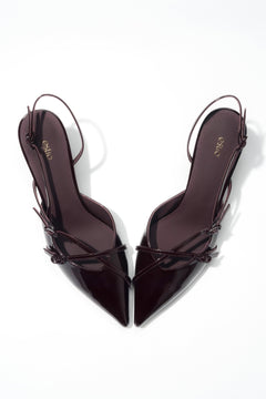 A striking upturned pointed toe – a unique design detail that gives the shoes a modern, edgy character.