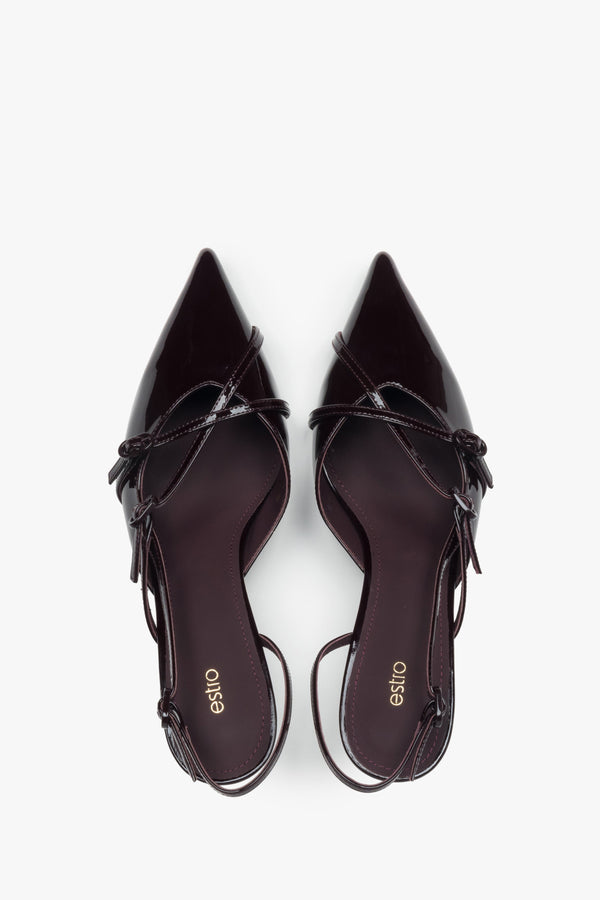 A sensual open-back cut and sleek silhouette – slingback design in the season’s most coveted colour.