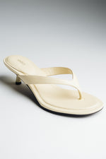 Women's butter yellow leather kitten heel mules by Estro