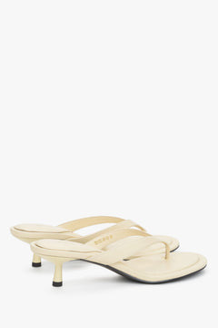 Back profile of women's butter yellow kitten heel mules by Estro