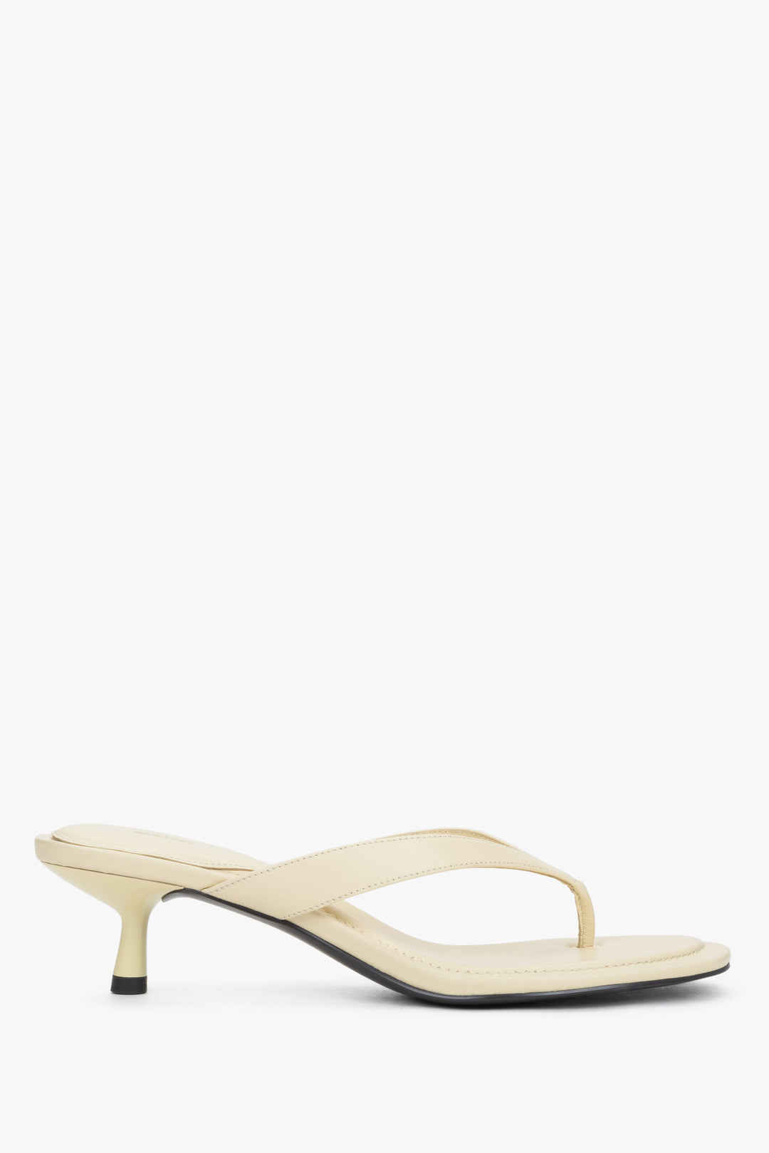 Side view of women's butter yellow leather mules with low heel