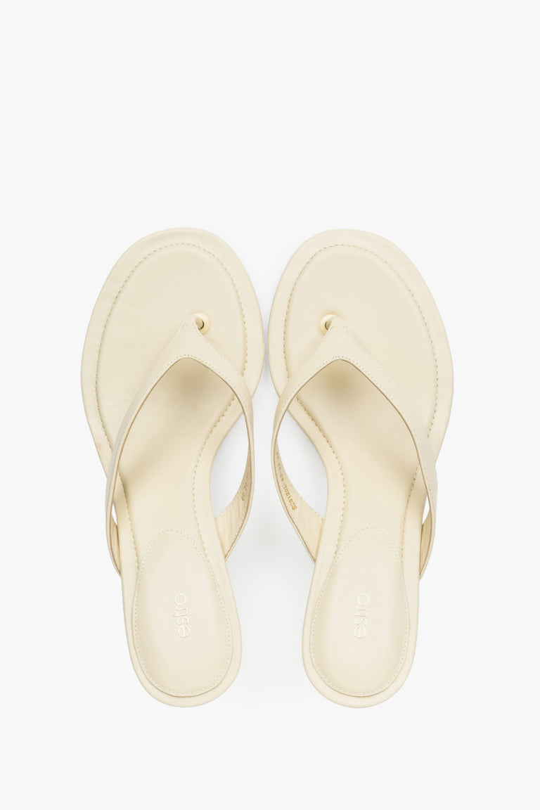 Top view of women's butter yellow leather mules by Estro