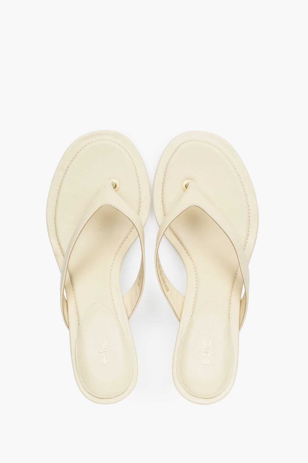 Top view of women's butter yellow leather mules by Estro