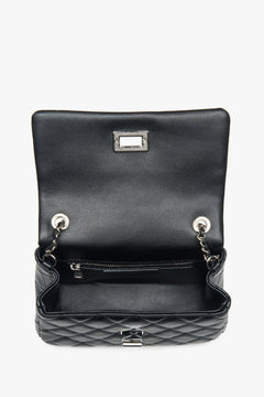 Women's black quilted handbag with silver chain, Estro.