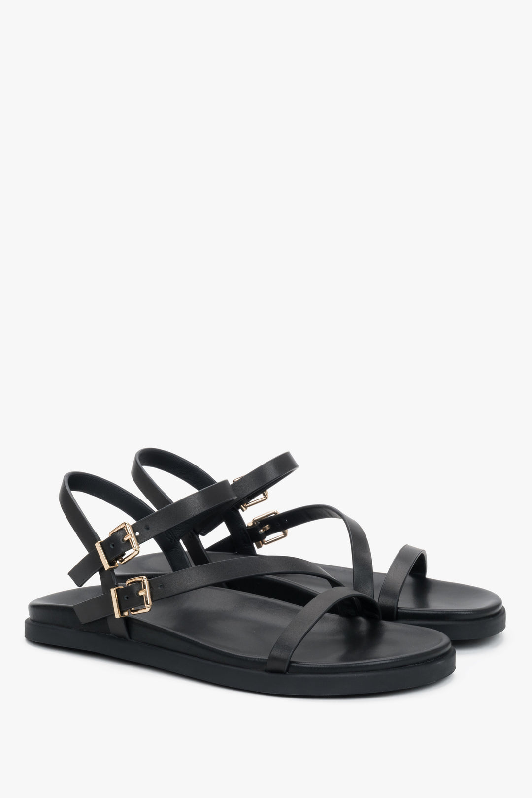 Comfortable women’s black leather sandals with thin straps.
