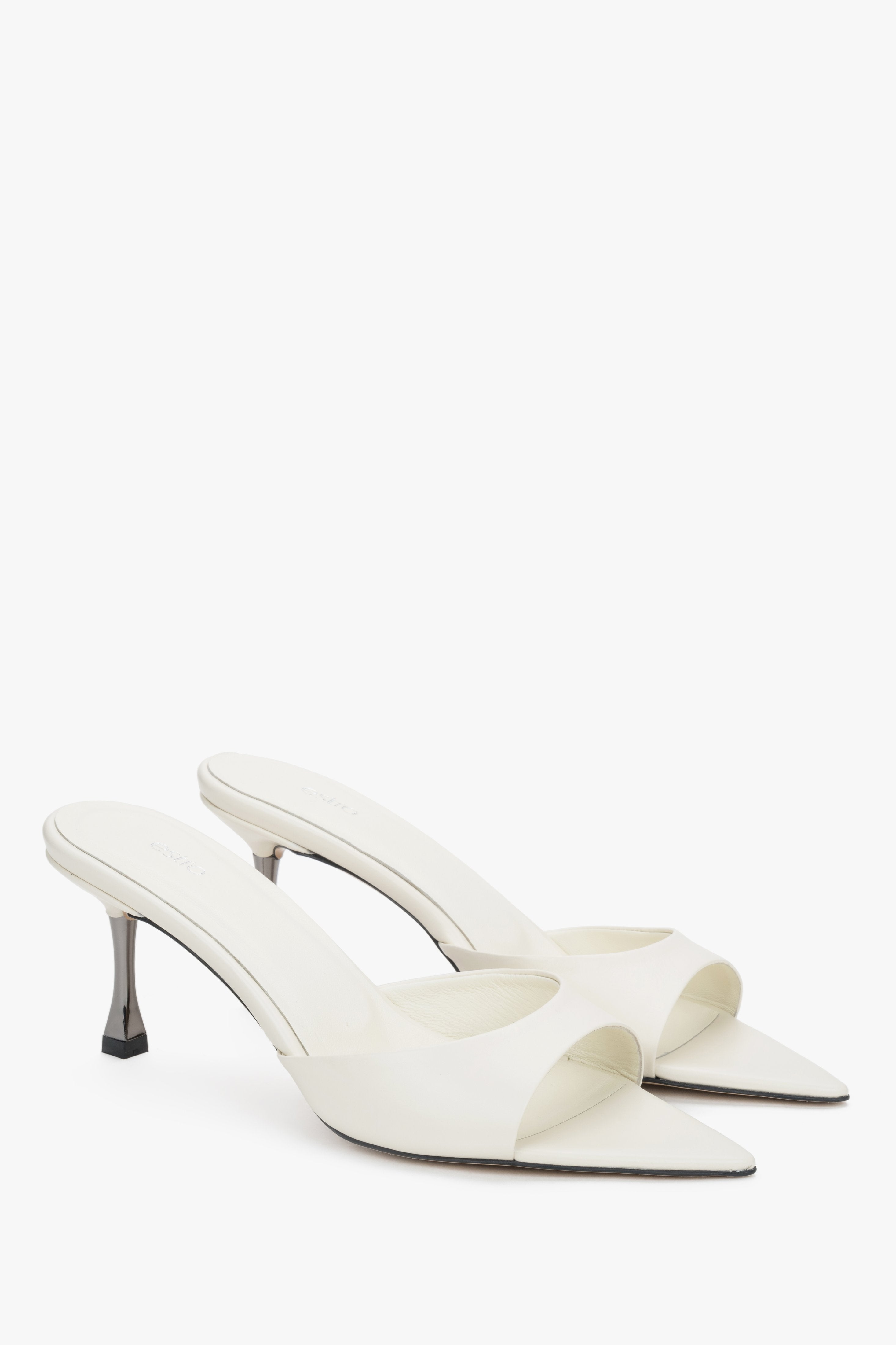 Angled view of women's cream beige leather pointed open toe mules