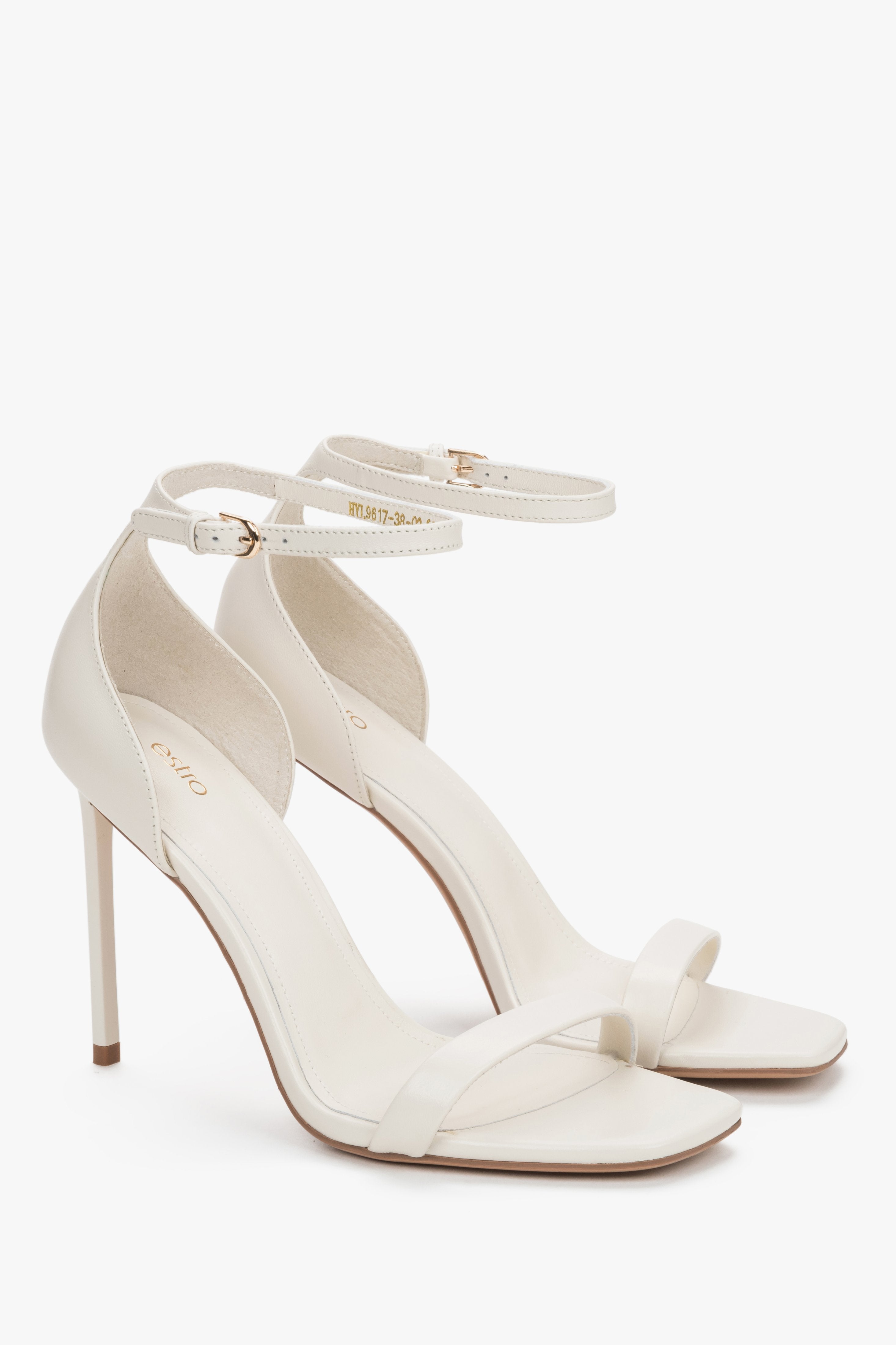 Side view of women's cream beige leather high heel sandals