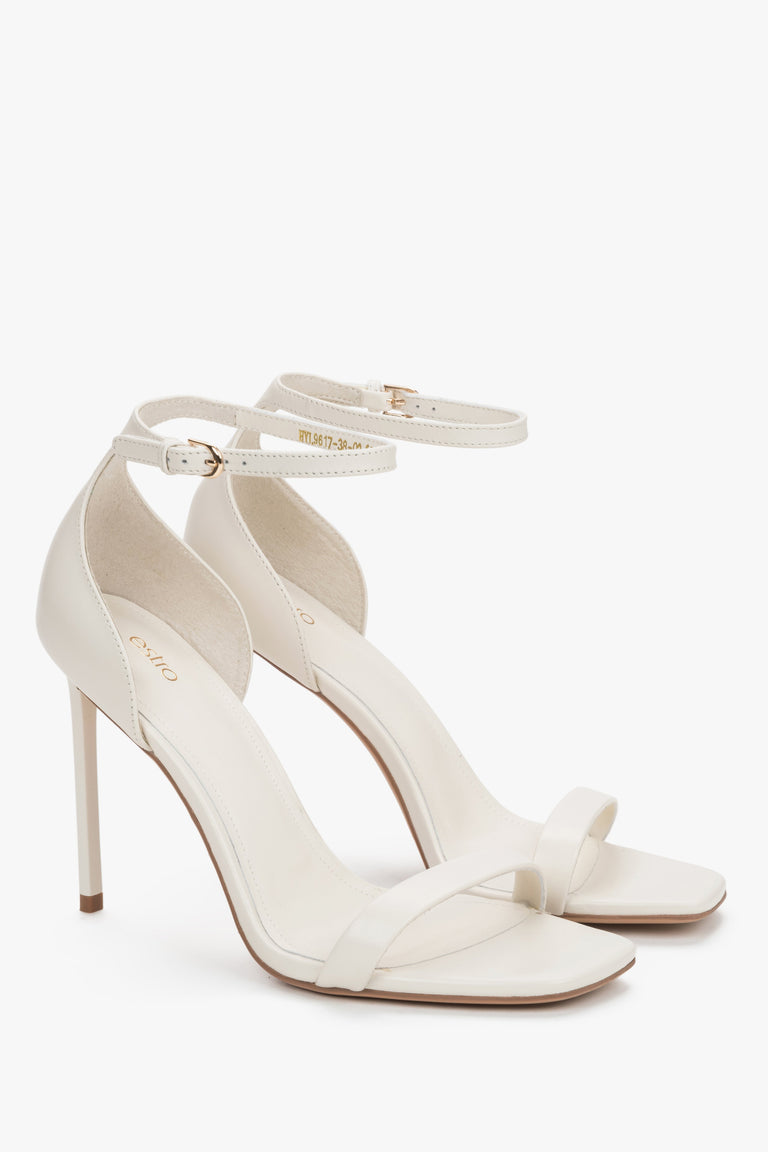 Side view of women's cream beige leather high heel sandals