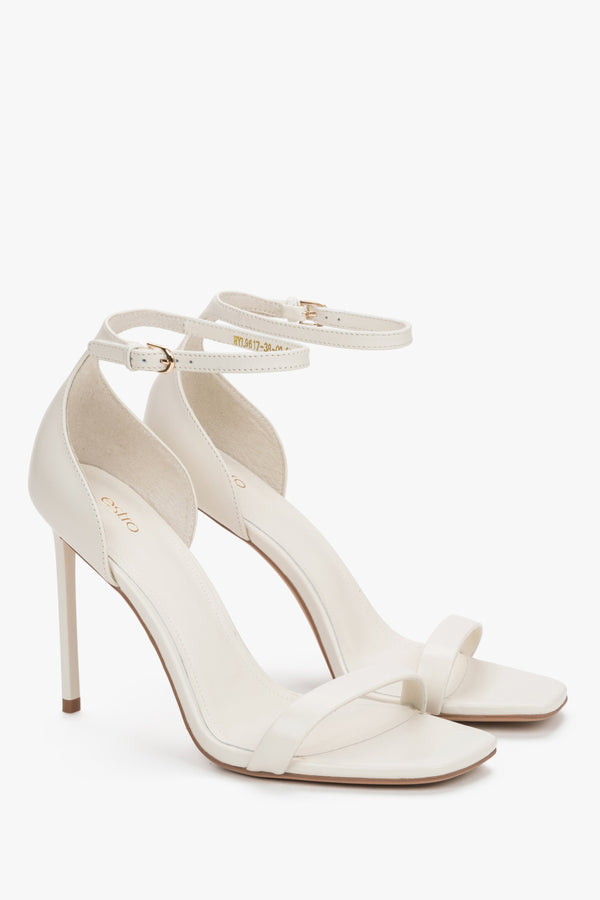 Side view of women's cream beige leather high heel sandals