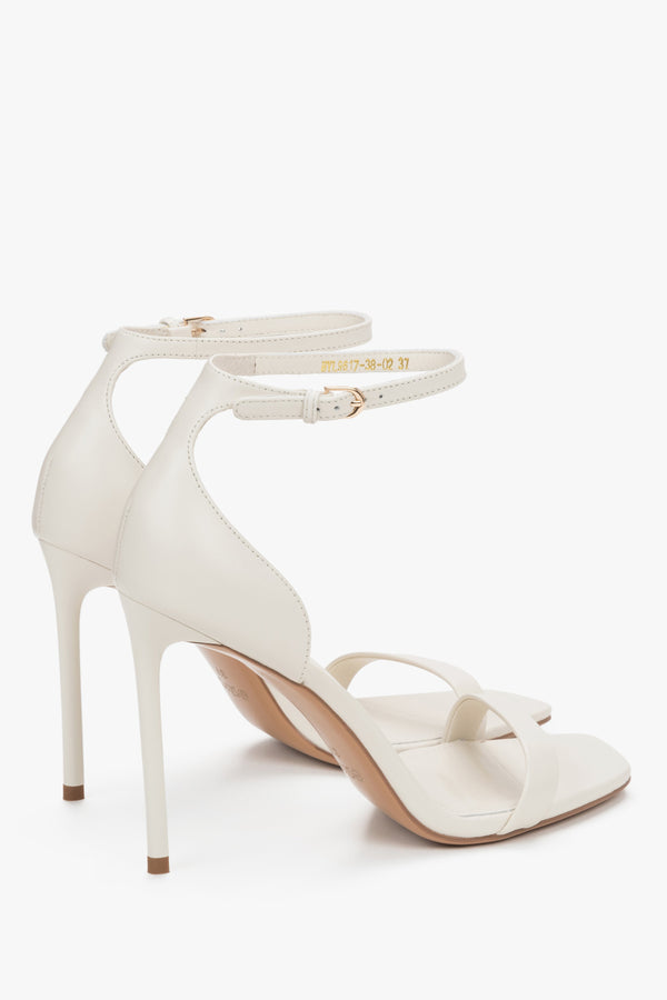 Angled view of women's cream beige leather sandals with 10.5 cm heel
