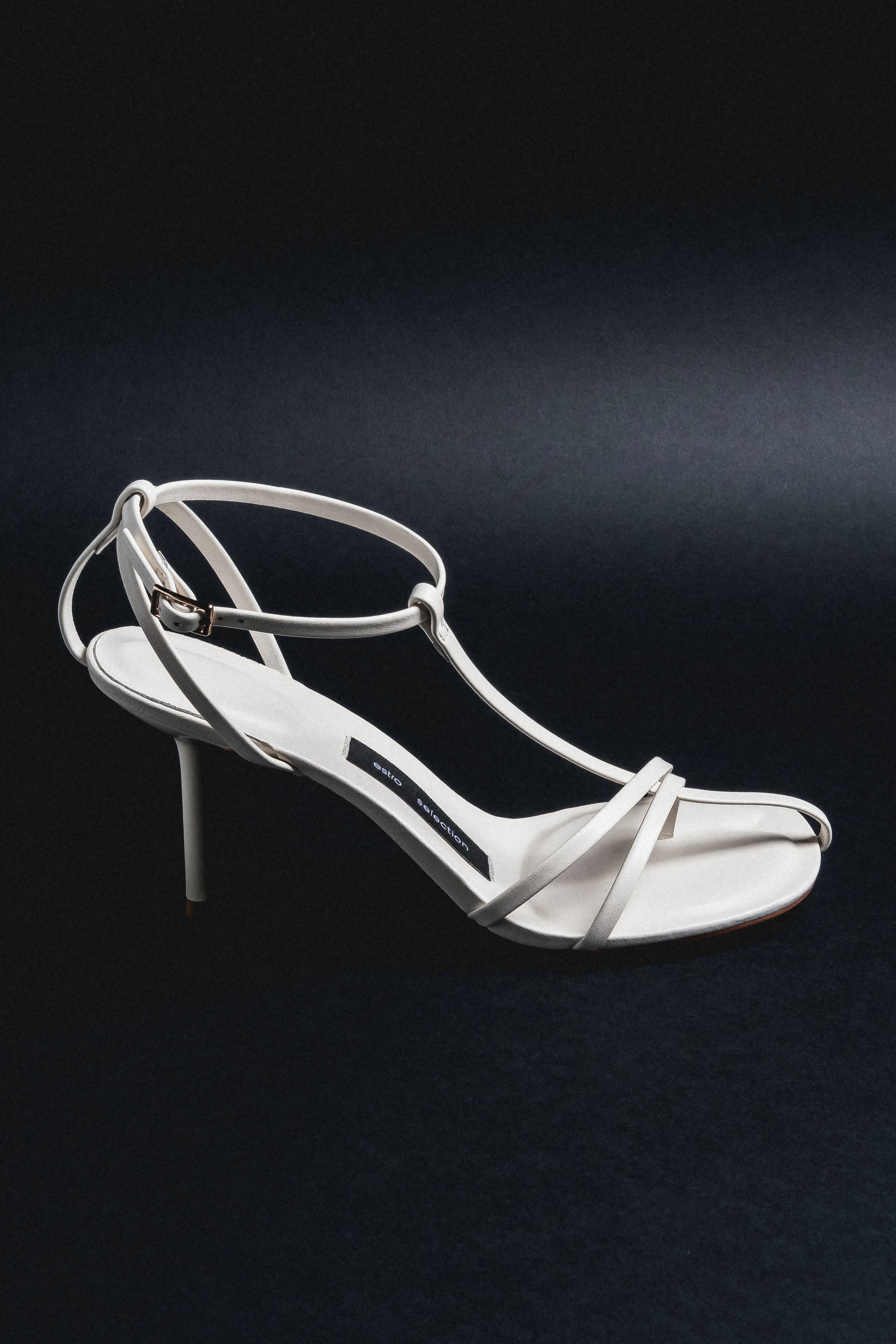 Side profile of cream beige leather stiletto sandal by Estro Selection
