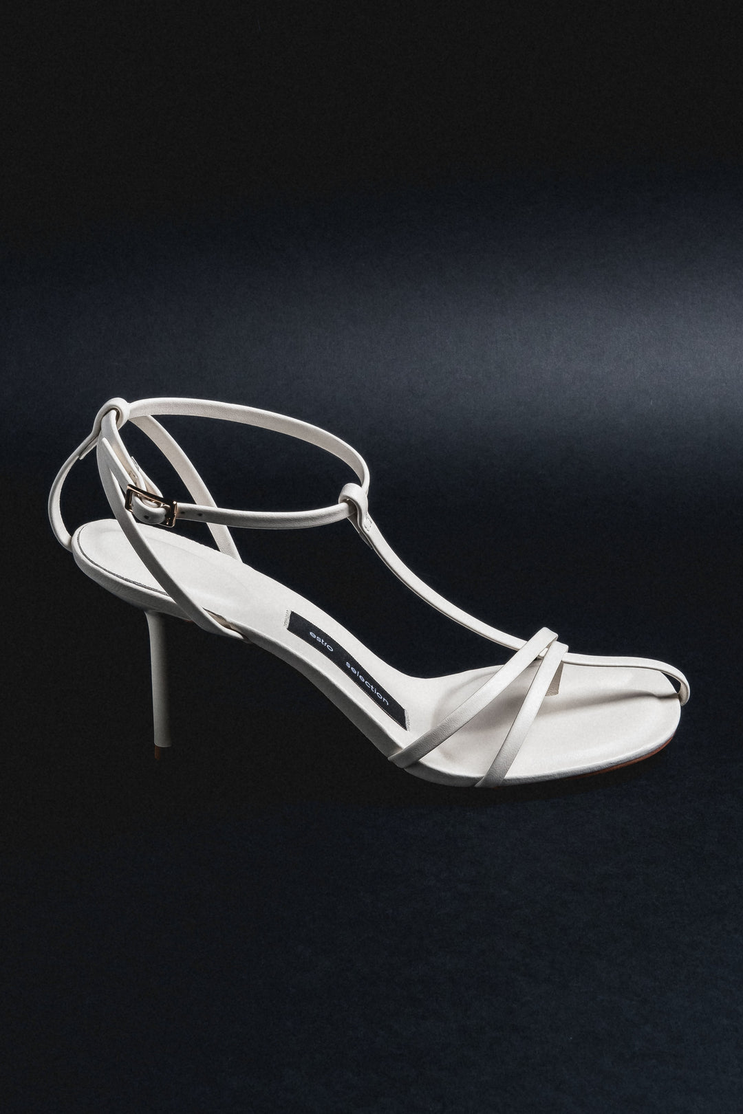 Side profile of cream beige leather stiletto sandal by Estro Selection