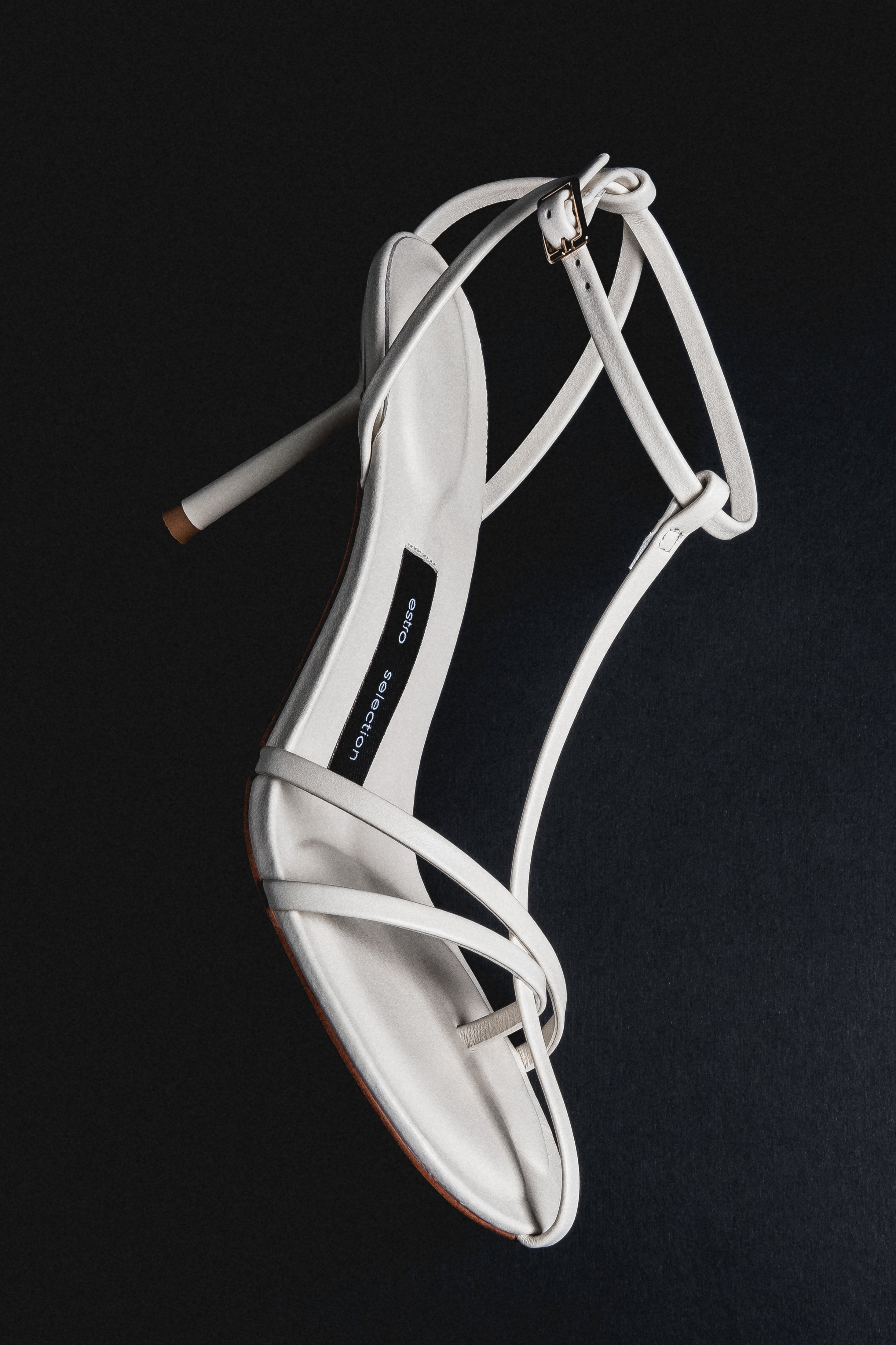 Women's cream beige leather high heel sandals styled on model