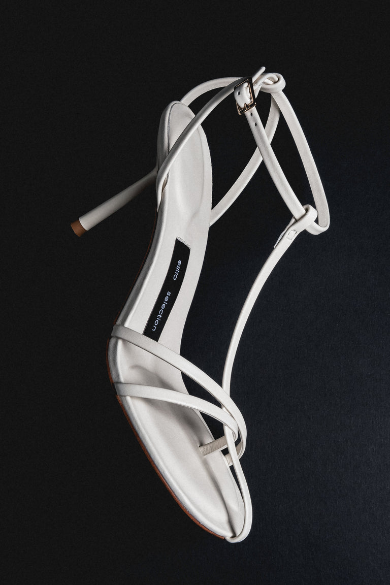 Women's cream beige leather high heel sandals styled on model